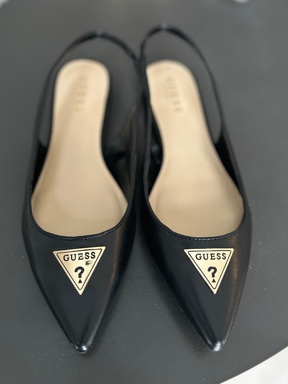 GUESS Black Pointed Slingback Flats with Gold Triangle Logo